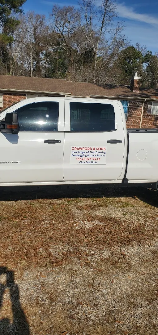 Side view of a white Crawford and Sons service truck